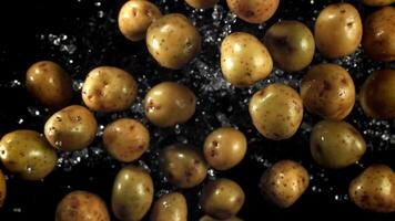 Potatoes fly up and fall down. Filmed on a high-speed camera at 1000 fps. High quality FullHD footage video