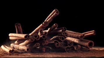 Cinnamon sticks fall on the table. Filmed on a high-speed camera at 1000 fps. High quality FullHD footage video