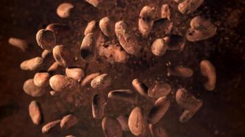 Cocoa beans fly up and fall down. Filmed on a high-speed camera at 1000 fps. High quality FullHD footage video