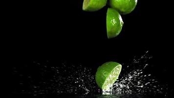 Sliced lime falls on a wet table. Filmed on a high-speed camera at 1000 fps. High quality FullHD footage video
