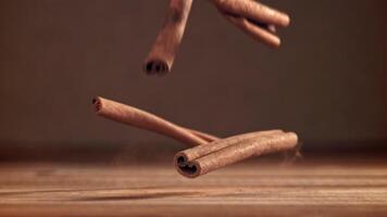 Cinnamon sticks fall on the table. Filmed on a high-speed camera at 1000 fps. High quality FullHD footage video