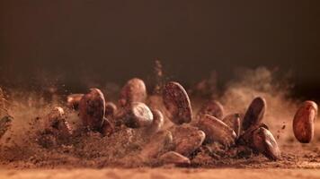 Cocoa beans fall on the table. Filmed on a high-speed camera at 1000 fps. High quality FullHD footage video