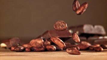 Cocoa beans fall on the table. Filmed on a high-speed camera at 1000 fps. High quality FullHD footage video