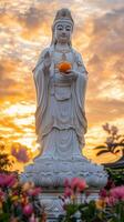 Majestic Guanyin Statue at Sunset Serene Garden Photography Tranquil Setting Inspirational View photo