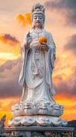Tranquil Sunset at the Majestic Guanyin Bodhisattva Statue photo