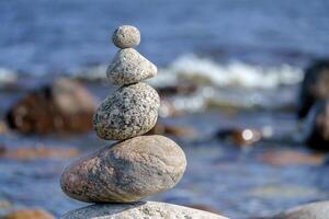 Pyramid of stones. Unstable balance of stone objects. beauty of nature and balance of interests. photo