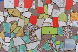Mosaic of multicolored pieces of broken tiles. Abstract background. photo