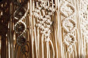 Intricate macrame design showcasing craftsmanship and artistic expression in warm sunlight photo
