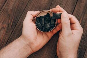 Exploring the unique taste of flavored licorice treats at a cozy gathering photo