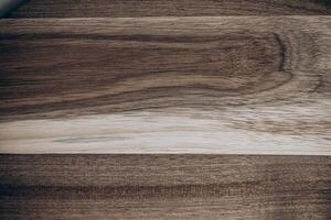 Natural wooden surface with varied grain patterns for artistic or design applications photo