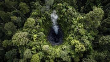 Steaming Crater in Lush Green Forest photo