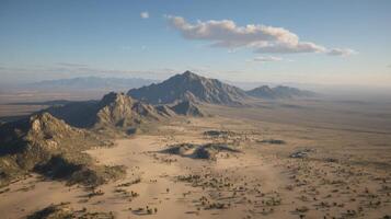 Aerial View of a Desert Canyon with Rippling Sand and Mountain Range photo