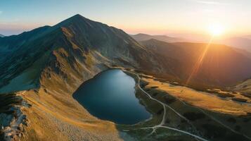 Aerial View of Serene Alpine Lake at Sunrise photo