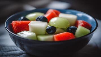 Vibrant Fruit Salad in Blue Bowl Close Up photo