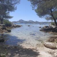 Tranquil Cove With Turquoise Water and Mountain View with Beautiful photo