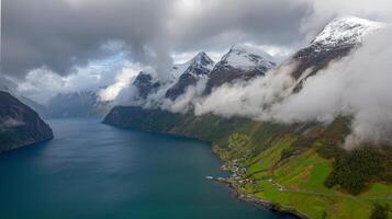 Aerial View of Serene Fjord with Steep Cliffs and Cloudy Sky photo