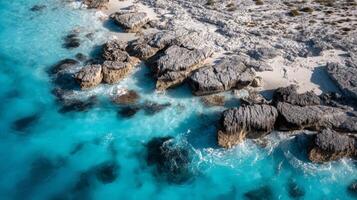 Aerial View of Tropical Beach with Turquoise Water and White Rocks photo