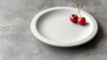 Two Ripe Cherries on a White Plate Minimalist Food Photography photo