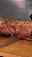 cut smoked meat Chef slices tender moist lean Texas beef brisket with precision, Pitmaster cuts perfectly smoked barbecue brisket portions for plates, slow motion close up 4K video