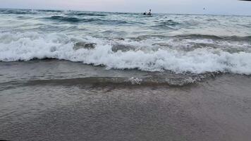 Mesmerizing ocean waves sandy shoreline aerial top view. Expanse ocean majestic waves sandy beach serene retreat Waves caress ocean edge beauty oceanic coast tranquility of coastal landscape. video