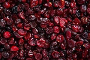 Dried cranberries filling the frame, creating a vibrant red background photo