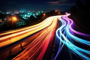 Colorful light trails streaking across a busy highway at night photo