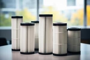 Set of industrial cartridge filters standing on table in modern building photo