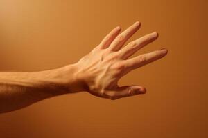 Man showing open hand on orange background photo