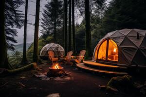 Cozy geodesic dome tents illuminated at twilight in a serene forest camping site photo
