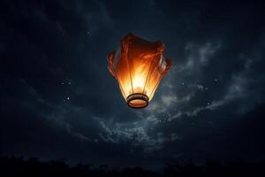 Sky lantern floating in night sky with other lanterns in background photo