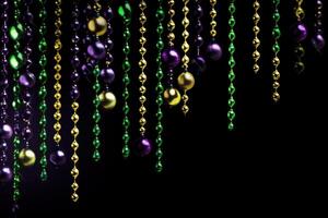 Mardi gras beads hanging on black background creating festive atmosphere photo