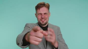Man pointing finger to camera, laughing out loud, making fun of ridiculous appearance, funny joke video