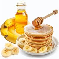 Stack of pancakes dripping with honey, bananas and honey jar on white background photo