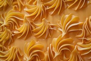Creamy caramel frosting swirls adorn a cake, creating a visually appealing texture photo