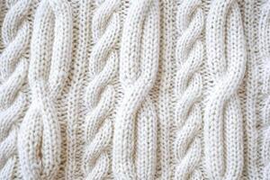 Cozy cable knit texture creating repeating pattern on white sweater photo