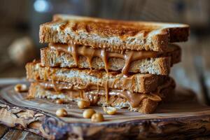 Toasted peanut butter sandwich dripping on wooden cutting board photo