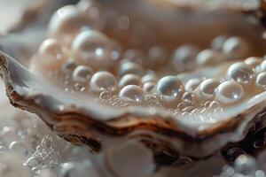 Many beautiful pearls lying inside an oyster shell with bubbles of water creating a luxurious atmosphere photo
