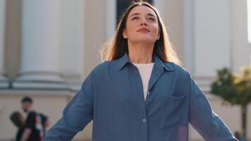 Young woman taking a deep breath of fresh air, relaxing, taking a break, resting, meditating outdoor video