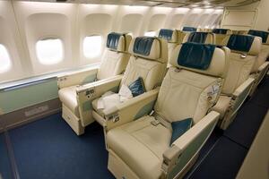 Empty first class seats awaiting passengers on modern airplane photo