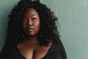 Plus size model posing with gray lipstick and curly hair photo