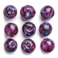 Fresh ripe wet blueberries arranged in grid pattern on white background photo
