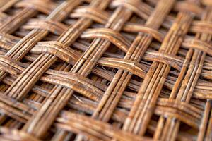 Interlaced straw creating textured pattern in handmade basket weaving photo
