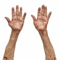 Senior woman showing her wrinkled hands on white background photo