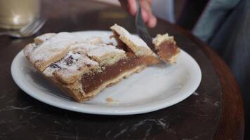 Delicious apple pie slice enjoyed in cozy cafe setting video