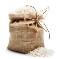 Burlap sack overflowing with white rice on white background photo