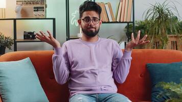 Confused indian man feeling embarrassed about ambiguous question, having doubts, no idea, no answer video