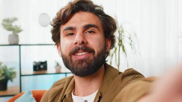 POV view man blogger taking selfie on smartphone call online conversation recording stories video