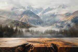 Empty wooden table overlooking a misty mountain landscape with colorful autumn foliage photo