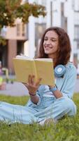 Preteen child girl relaxing interesting book turning pages smiling enjoying literature taking a rest video