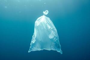 A plastic bag floating in the ocean photo